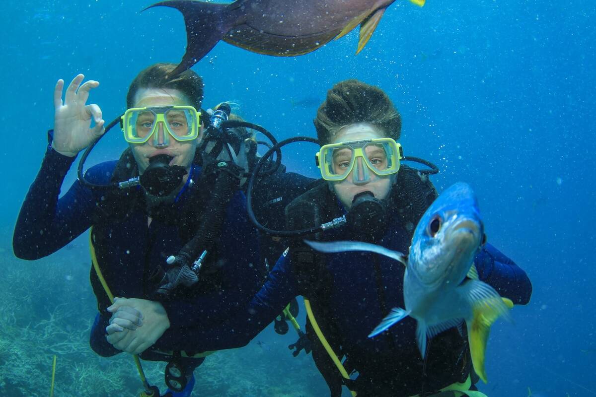 Make-A-Wish Australia wish kid Sam diving with brother at Hamilton Island