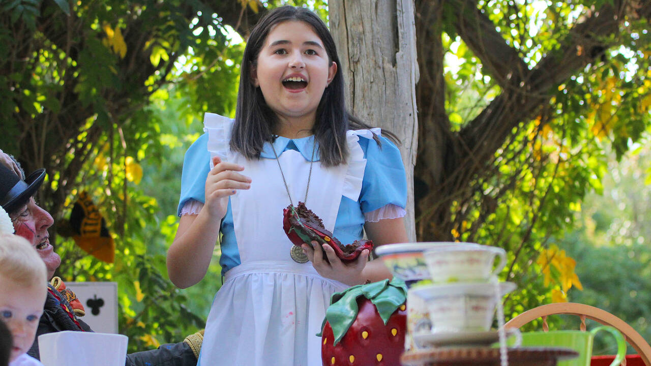 Make A Wish Australia Children's Charity - Sophie on her Alice in wonderland wish eating cake at the tea party