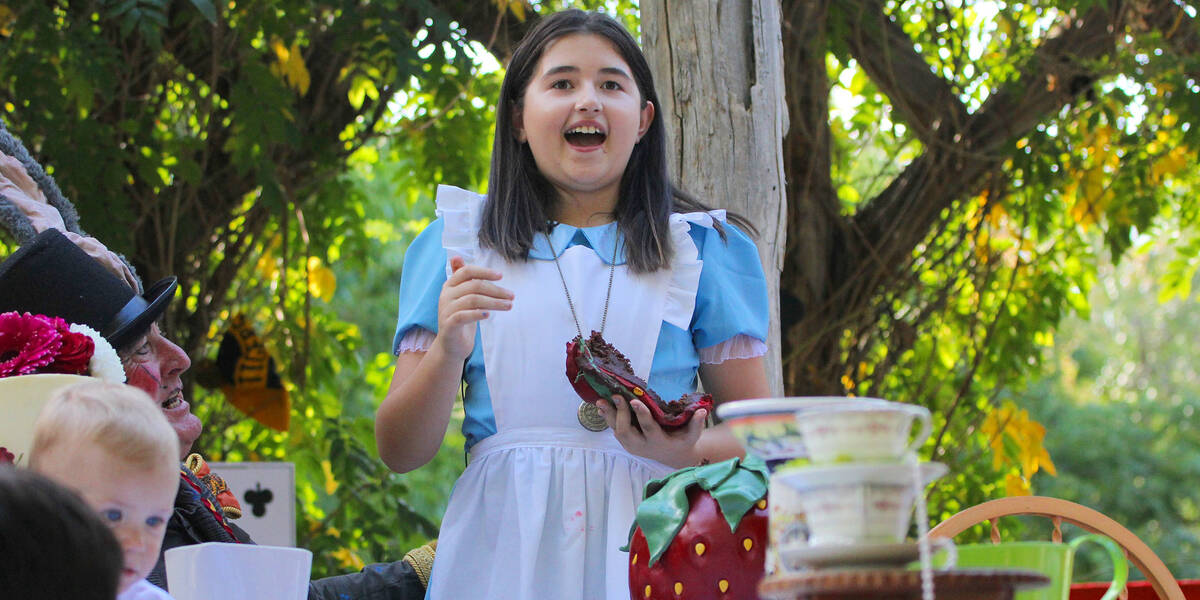 Make A Wish Australia Children's Charity - Sophie on her Alice in wonderland wish eating cake at the tea party