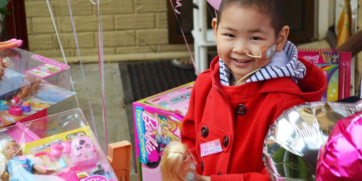 Make-A-Wish wish kid Maple with her Barbies