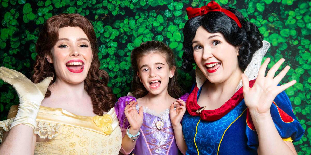 Make-A-Wish Australia wish kid Savannah with Disney princesses Snow White and Cinderella