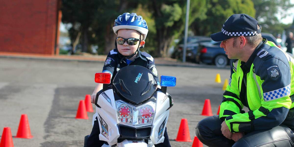 Make-A-Wish Australia wish kid Benjamin on a police bike