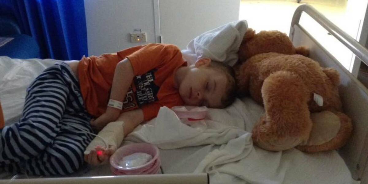 Make-A-Wish Australia wish kid Benjamin lying in a hospital bed