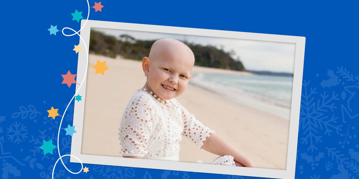 Make-A-Wish Australia wish kid Kaylee sat on a beach