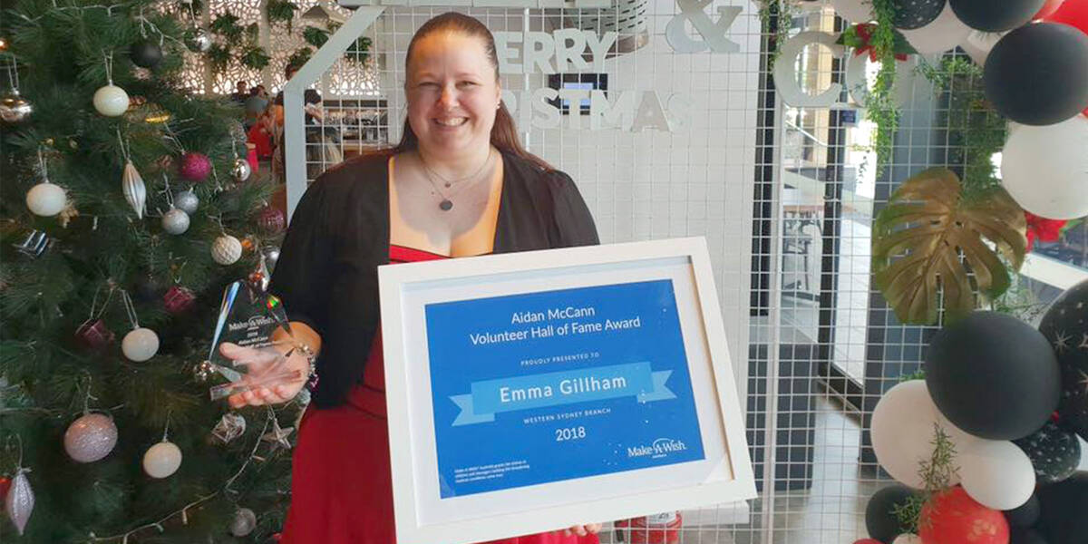 Make A Wish Australia Children's Charity - Hall of fame volunteer winner 2018 Emma standing with her certificate