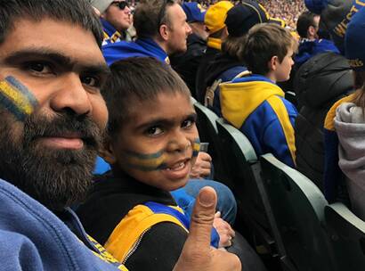Make A Wish Australia Children's Charity - Edgar on his wish with his dad watching the West Coast Eagles AFL game