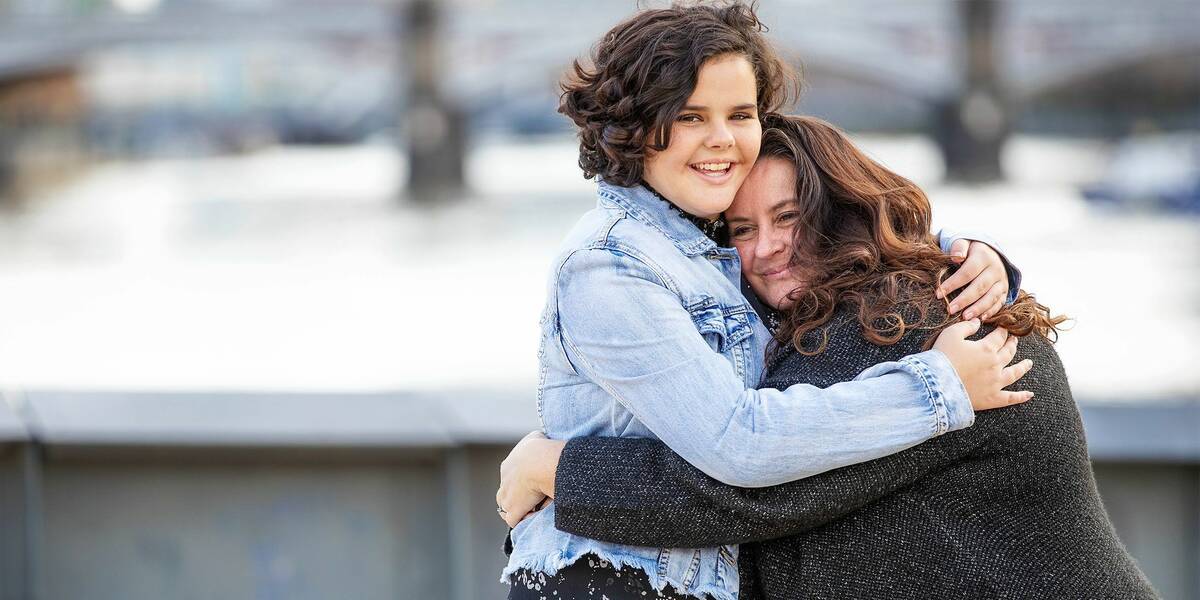 Make-A-Wish Australia wish kid Chelsea hugging her mum in Melbourne