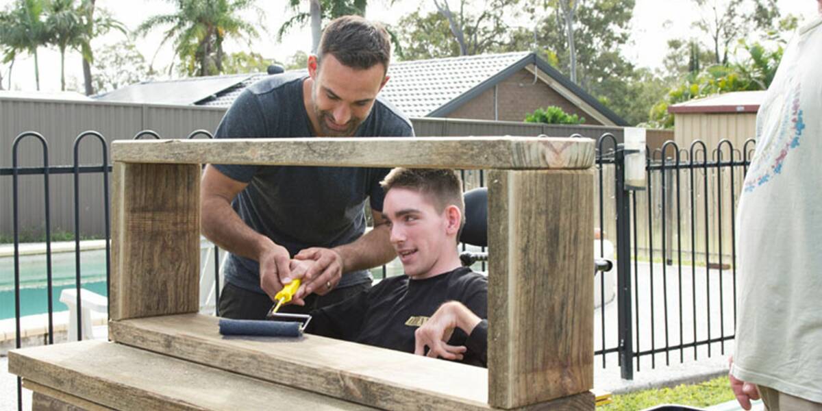 Make-A-Wish Australia wish kid Samuel with Better Homes and Gardens resident builder Adam Dovile