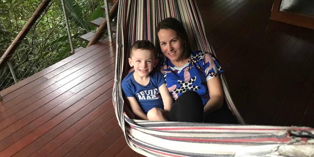 Make-A-Wish Australia wish kid Zak with his mum in a hammock