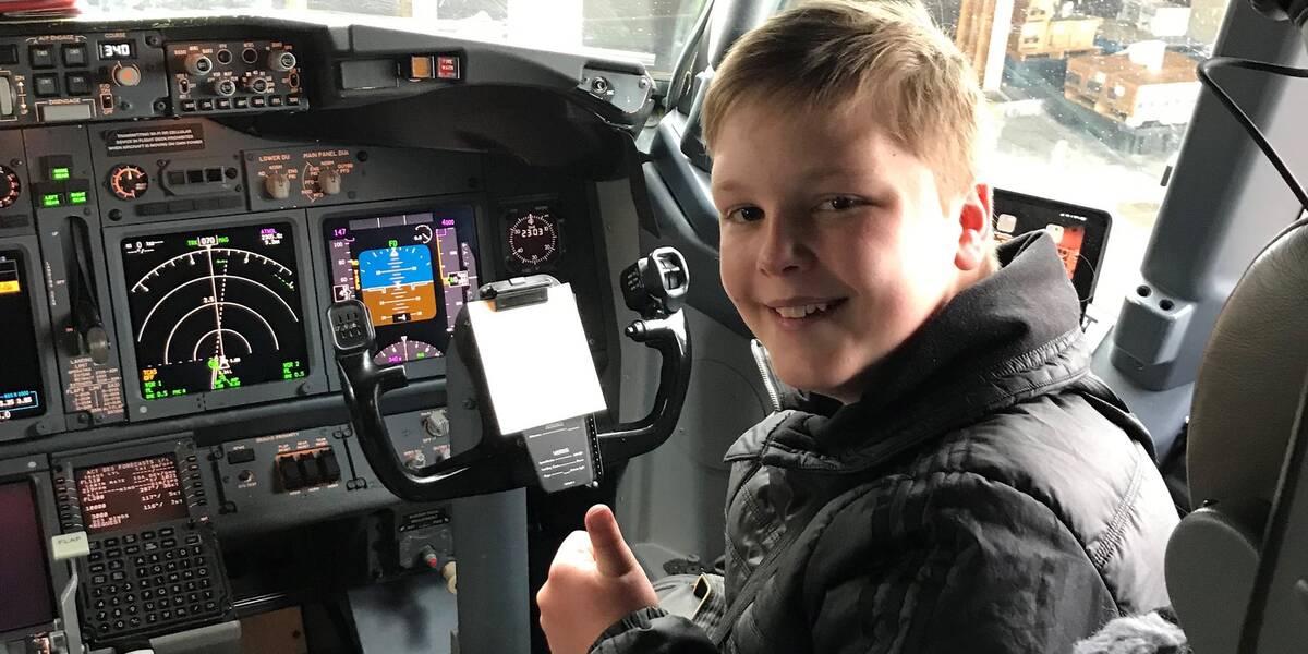 James sitting in the cockpit