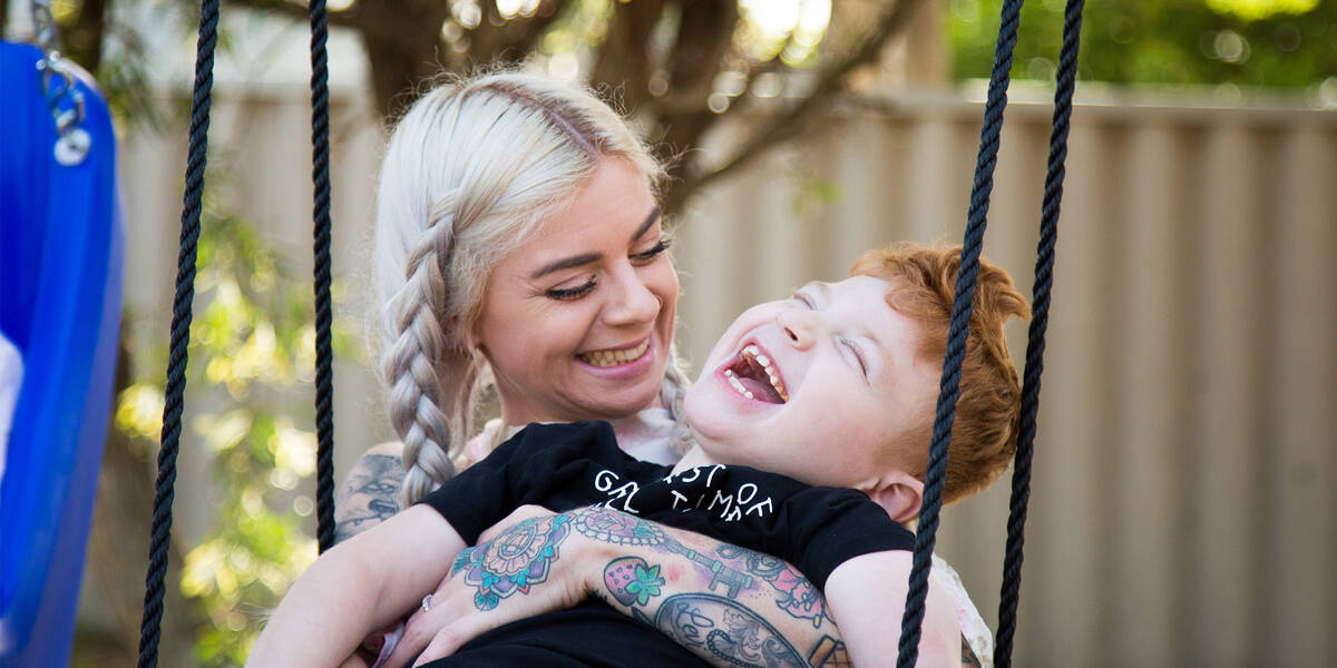 Make-A-Wish kid Levi with his mum on his swing