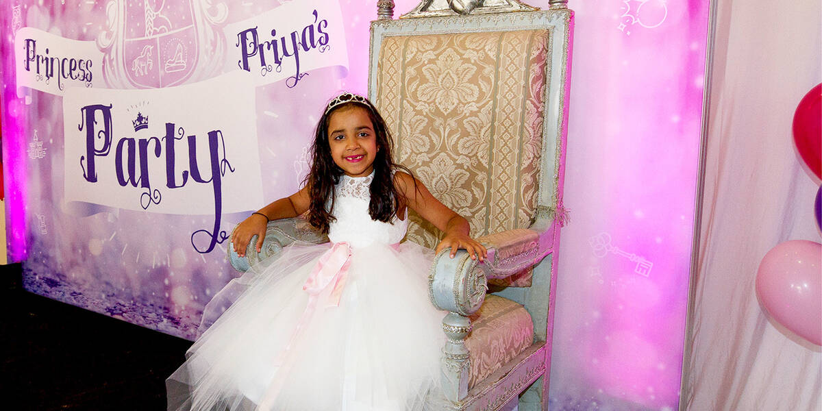Make-A-Wish kid Priya sits on a special throne on her wish to be a princess