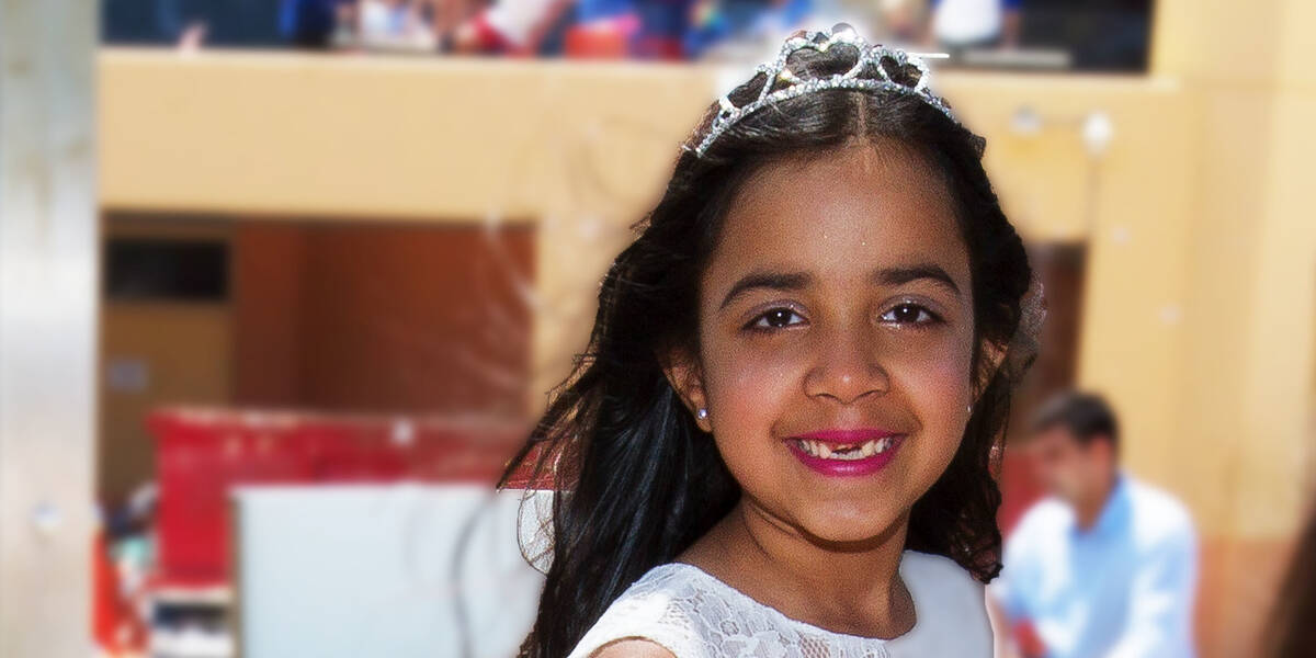 Make-A-Wish kid Priya smiles happily on her wish day to be a princess and have a tea party