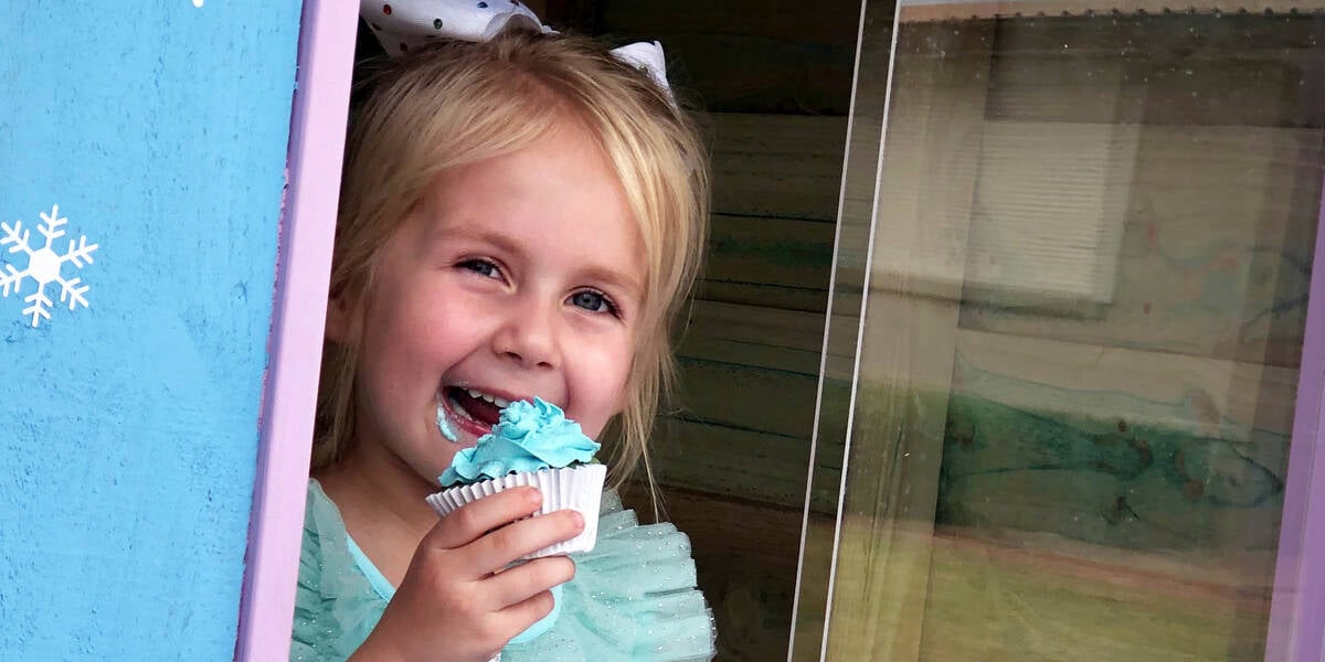 Make-A-Wish kid Penelope eats a frozen themed cupcake in her frozen themed cubby on her wish day