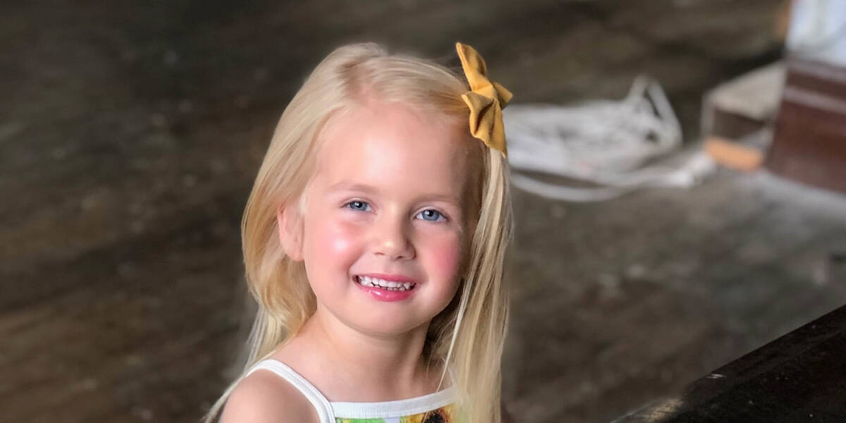 Make-A-Wish kid Penelope smiles at the camera ahead of her wish day