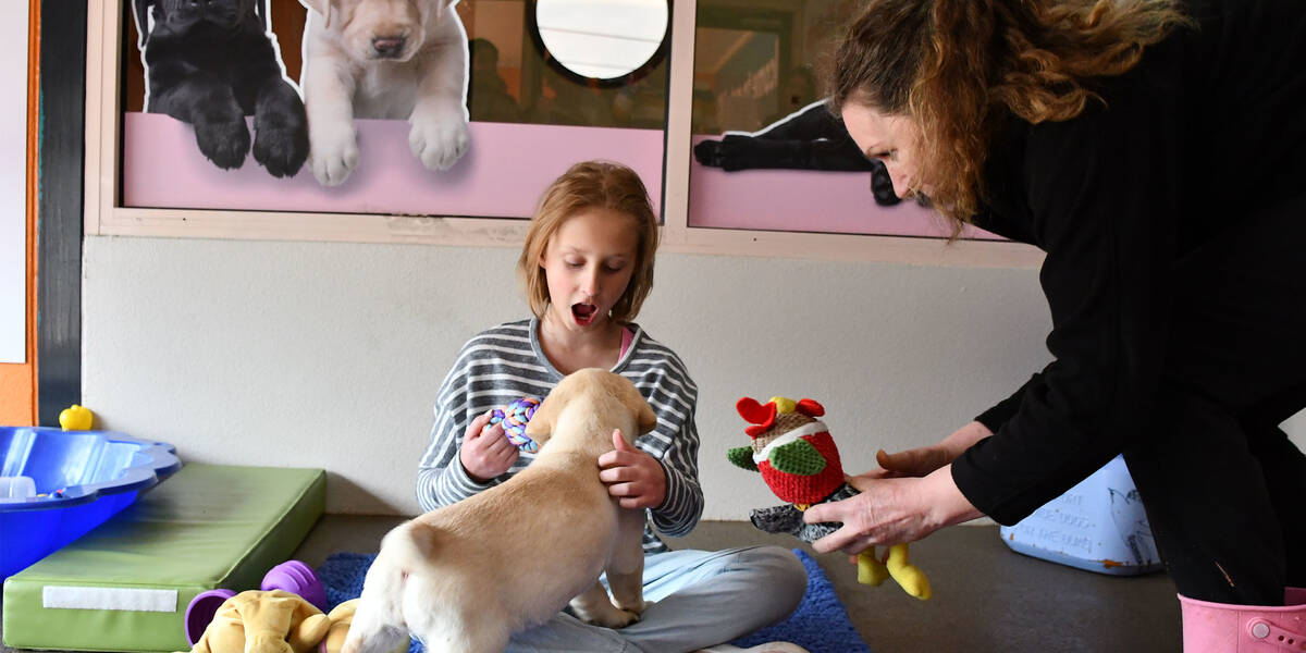 Wish kid Ava with a puppy