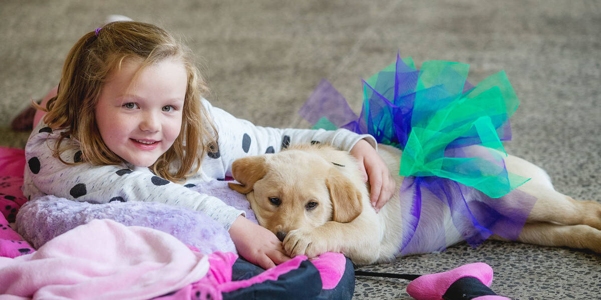 Charli meeting her puppy Lola