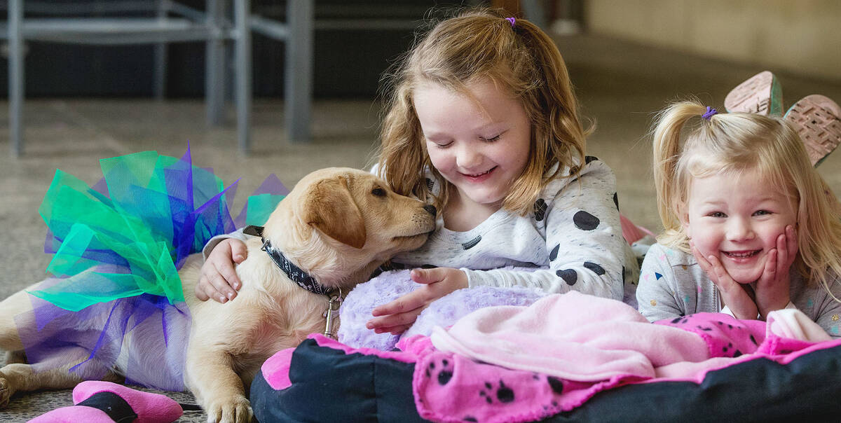 Charli and her sister with puppy Lola