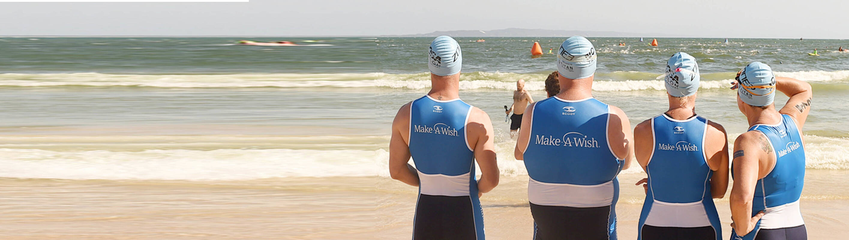 Make A Wish Australia, Children's Charity - Team Wish at the Noosa Tri event facing the water