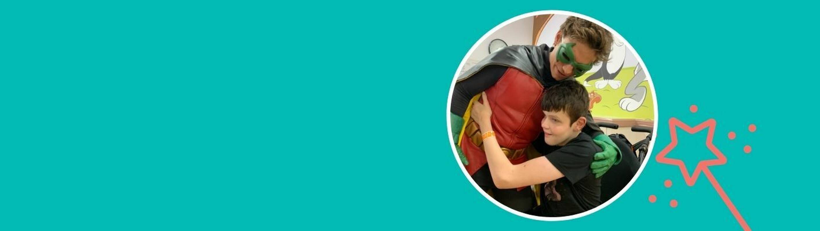 Make-A-Wish Australia wish kid Jerrah hugging superhero robin