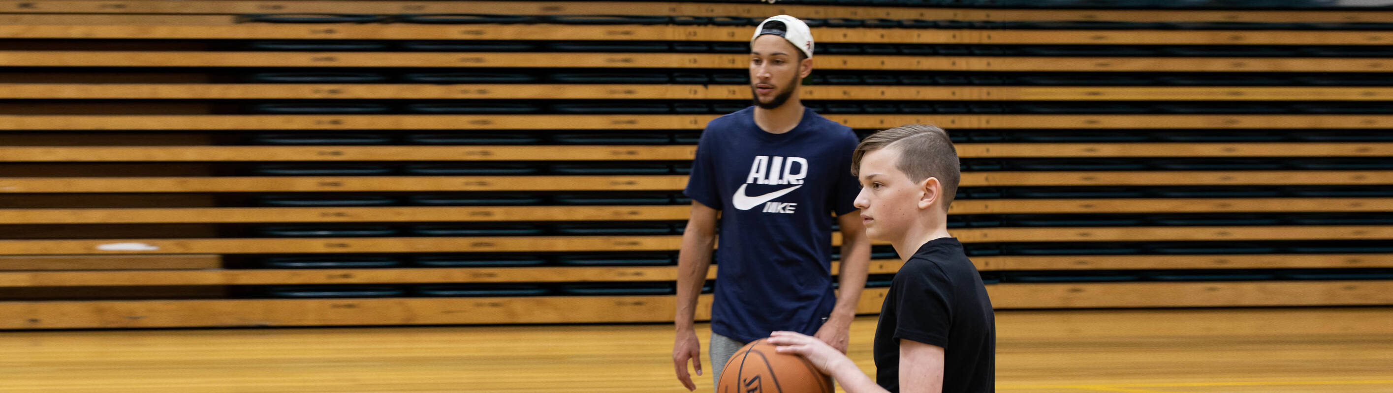 Make-A-Wish Australia wish kid Claude playing basketball with NBA star Ben Simmons