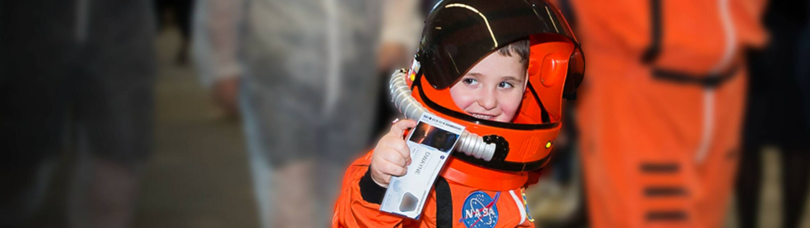 Make-A-Wish Australia wish kid Dwayne wearing his NASA astronaut spacesuit
